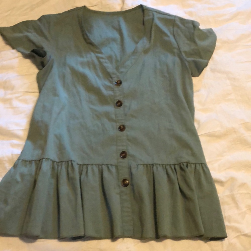 Drop hem top with button detail